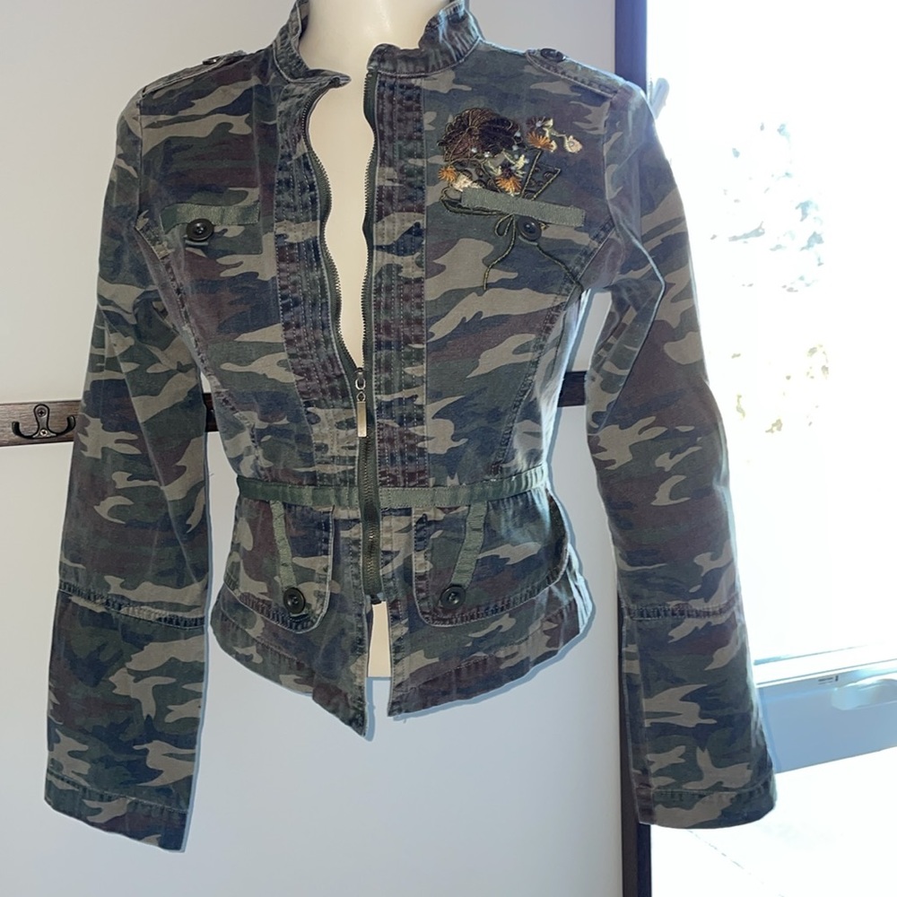 Youth Camo Zip up Jacket with floral embroidery accent .